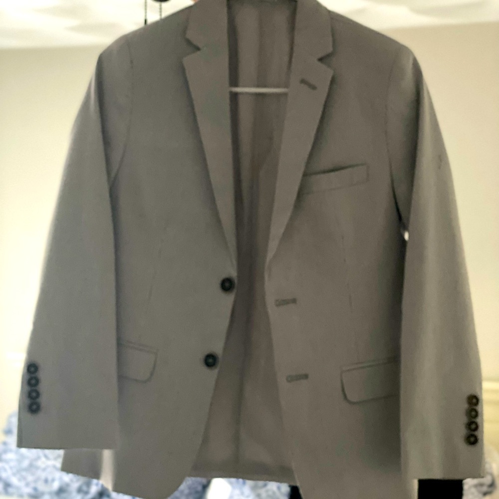 Calvin Klein Sport jacket. Never worn. 12 Boys. Lt blue w/stripes fabric.